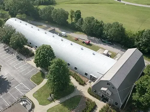 Spray polyurethane foam roofing system on a commercial building